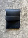 Pocket wallet with flap Black Closed on cutting table