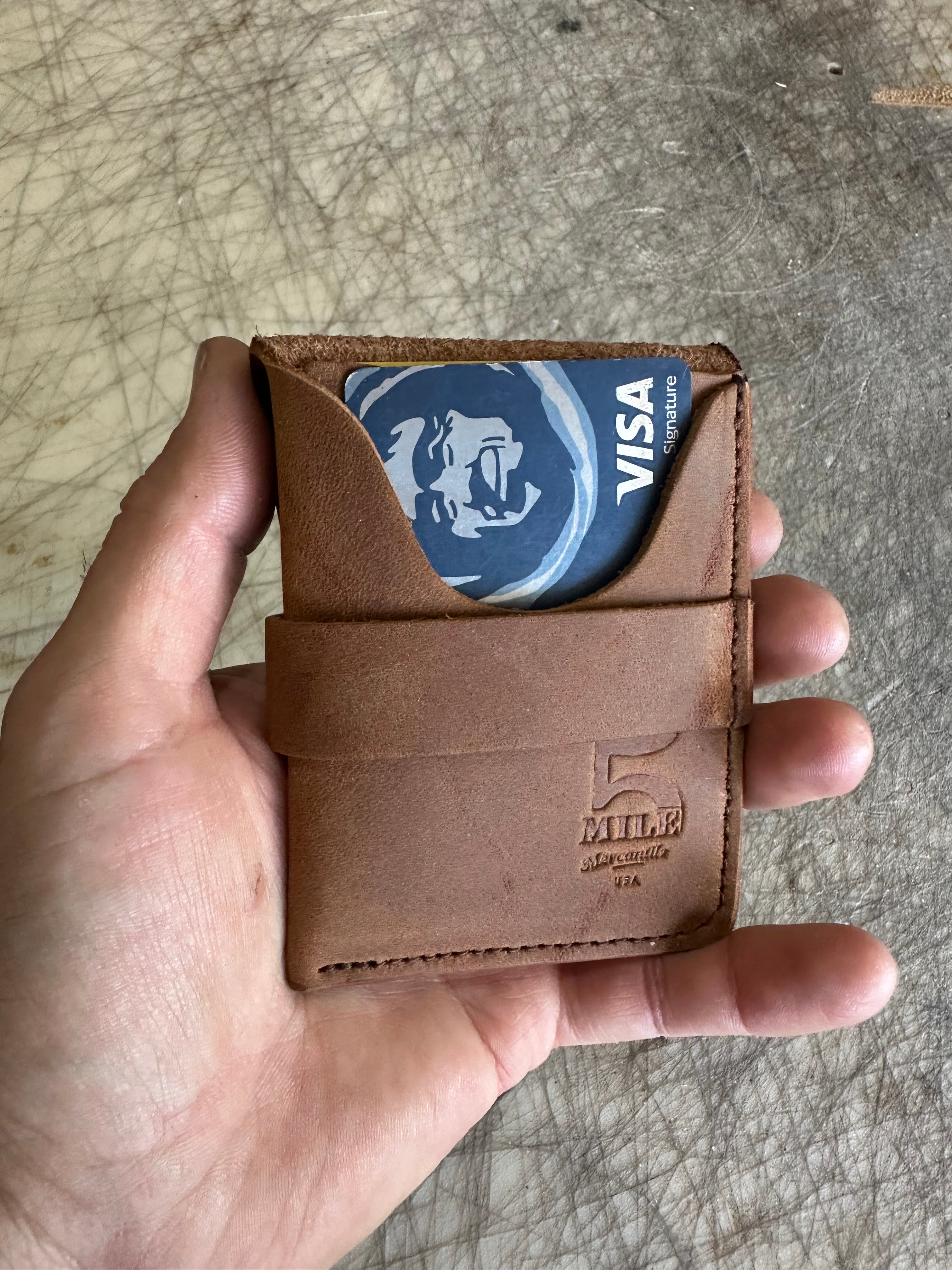 Pocket wallet with flap Brown flap open on cutting table