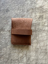 Pocket wallet with flap Brown flap tucked in back on cutting table