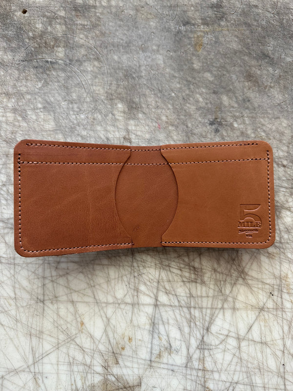 3 pocket bifold wallet Coffee color on cutting table