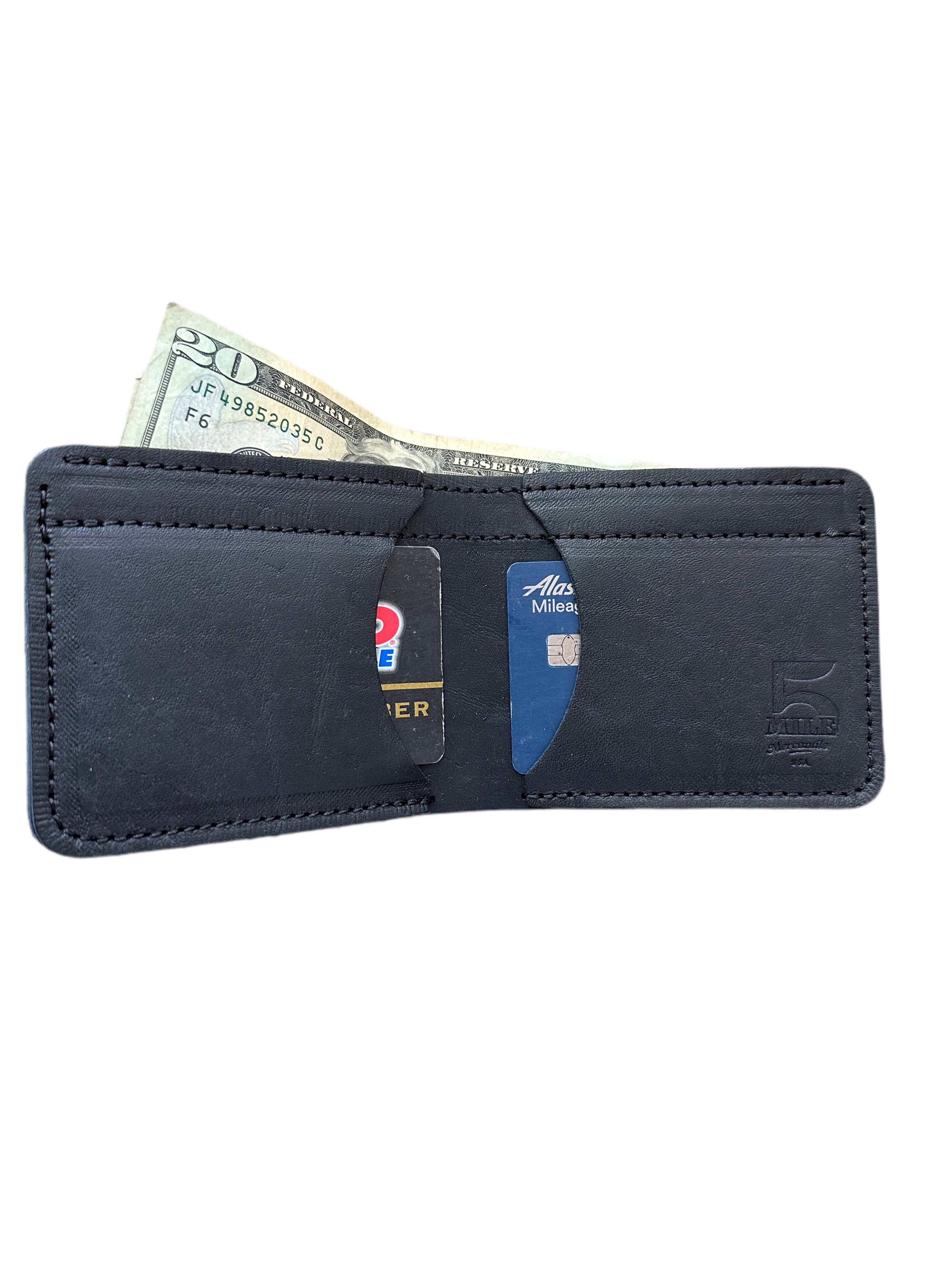 3 pocket bifold wallet black with cards and money on cutting table