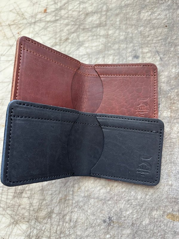 3 pocket bifold wallets on cutting table