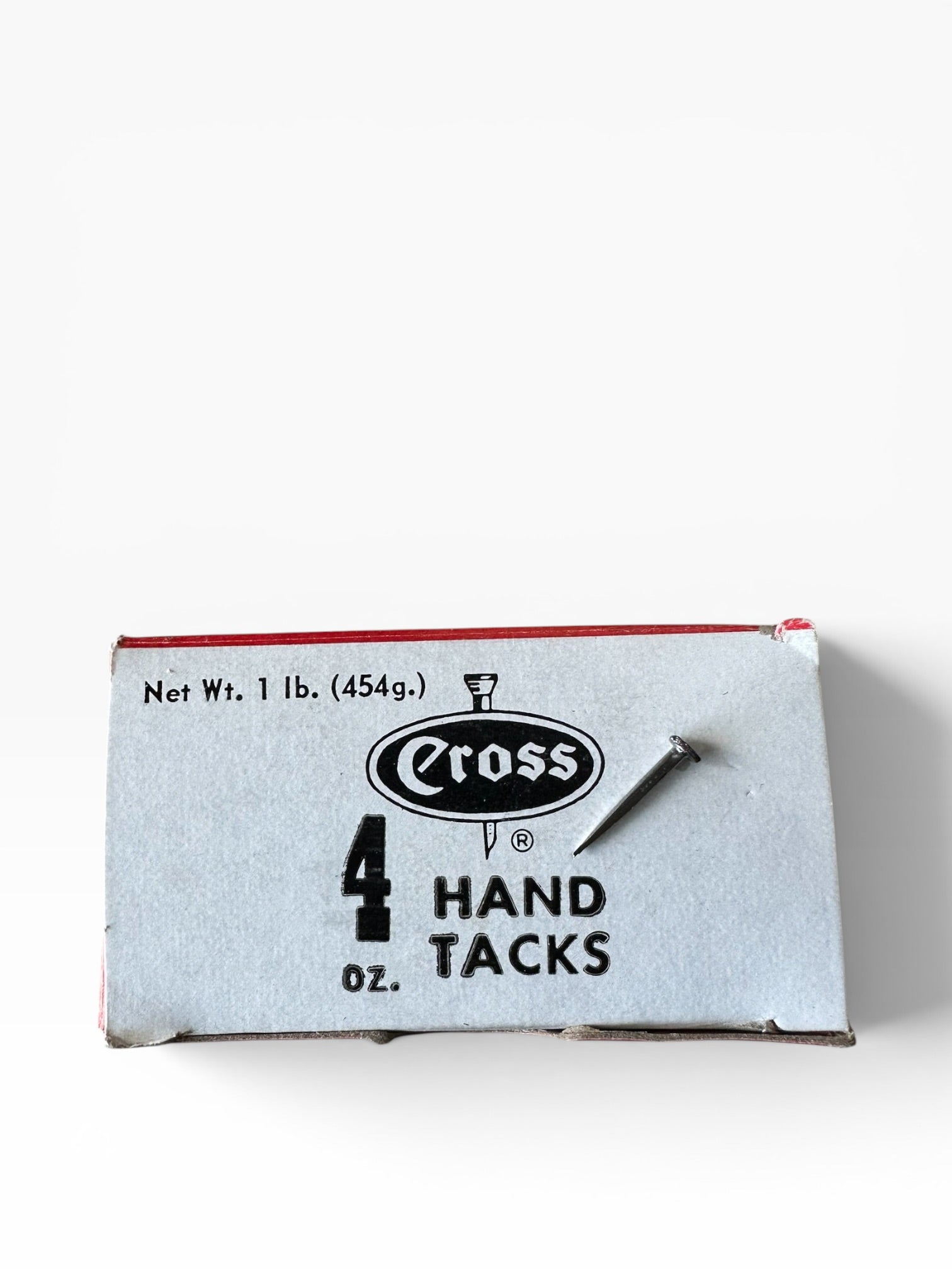 Box of Cross hand tacks on a white background