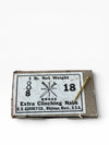 Box of brass nails with a label on a white background