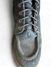 Black boot zoomed in on laces with transparent background