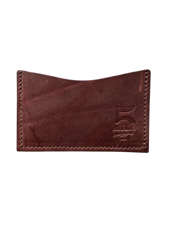Brown leather cardholder with stitching detail on a white background