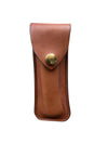 Brown leather pouch with a brass snap  on a white background