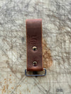 DIYer measuring tape holder on cutting table