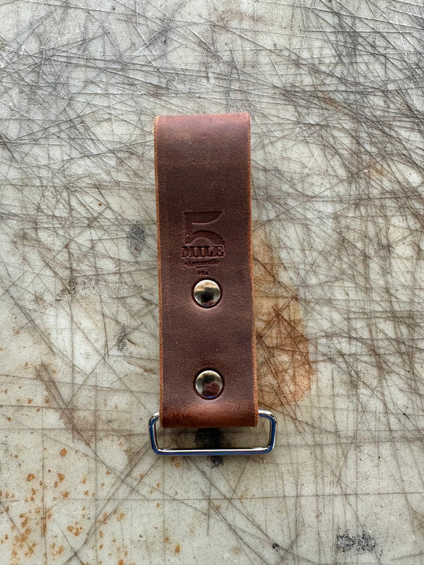 DIYer measuring tape holder on cutting table