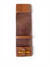 Brown leather pen holder with a yellow pen on a white background