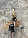 Granger Belt Black Veg Tan Side Profile on Cutting Board