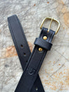 Granger Belt Black Veg Tan on Cutting Board