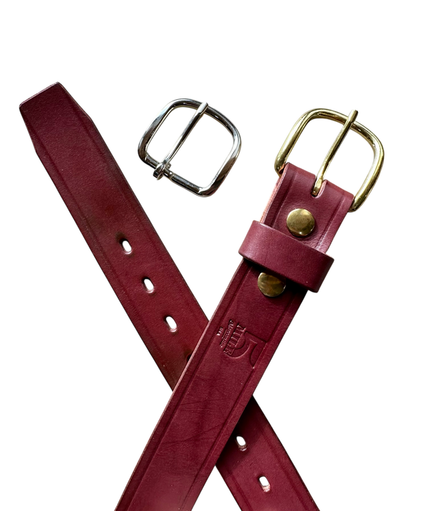 Two maroon leather belts with metal buckles on a white background