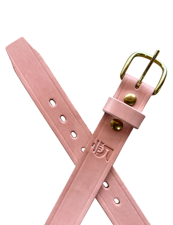 Pink leather belt with gold buckle on a white background