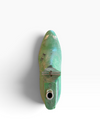 A small, vintage-style green metal object with a pointed top, weathered patina, and a circular hole near the bottom, photographed against a plain white background.