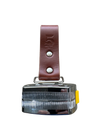 Brown leather strap holding measuring tape