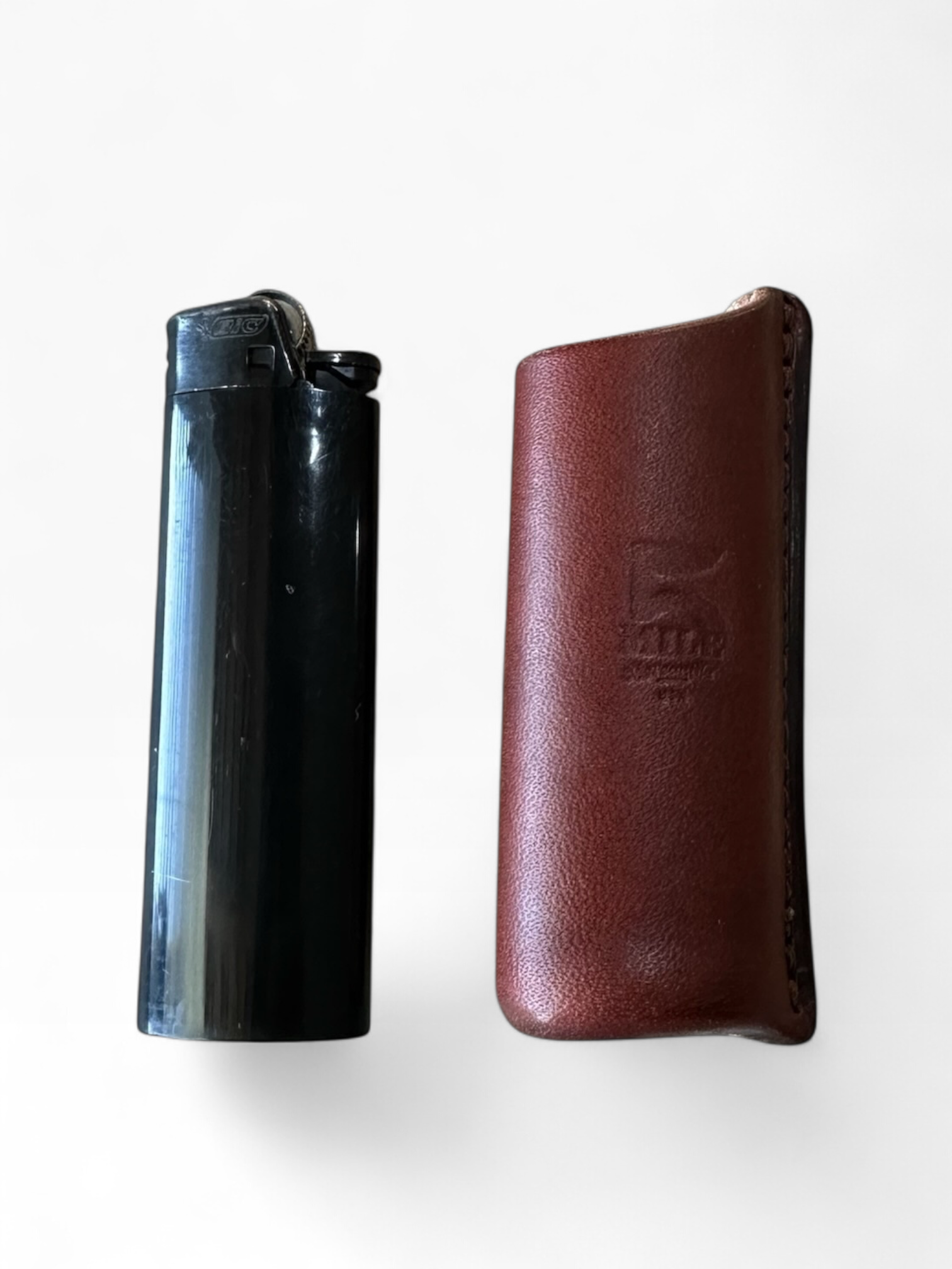 Leather lighter sheath with finger grooves with white background