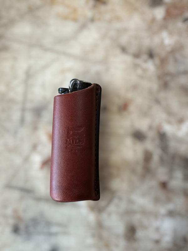 Leather lighter sheath on a cutting table