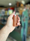Leather lighter sheath with finger grooves in hand