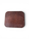 Brown leather mouse pad with brand logo on a white background