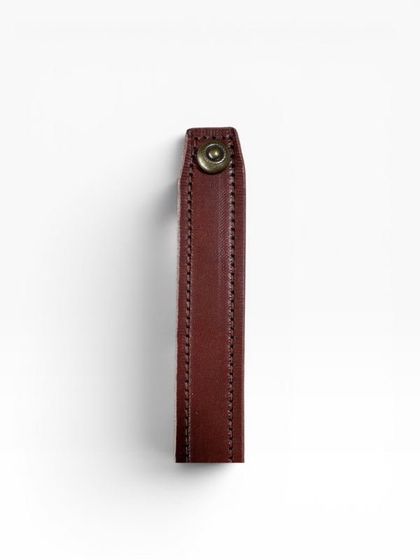 A close-up of a dark brown leather strap or loop with visible stitching and a brass snap button, shown against a plain white background.