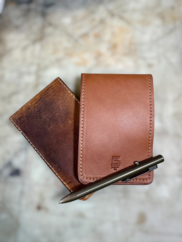 Notepad Pocket Wallet With Pen and Notepad on Cutting Board Closed