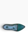 The outsole of a vintage pointed-toe shoe, showing a weathered teal and blue-green patina with circular tread details, photographed on a clean white background.