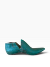 A vintage wooden shoe tree with a distressed teal-green patina, shown in profile against a clean white background.