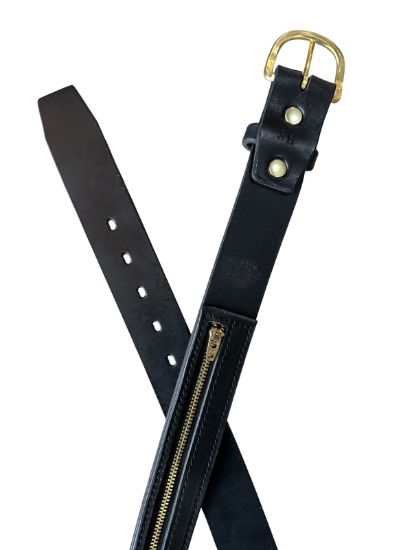 Black leather belt with brass zipper on a white background