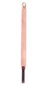 Pink leather strap with a gold ring on a white background