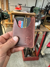 Vertical Card Wallet in hand with card in slot