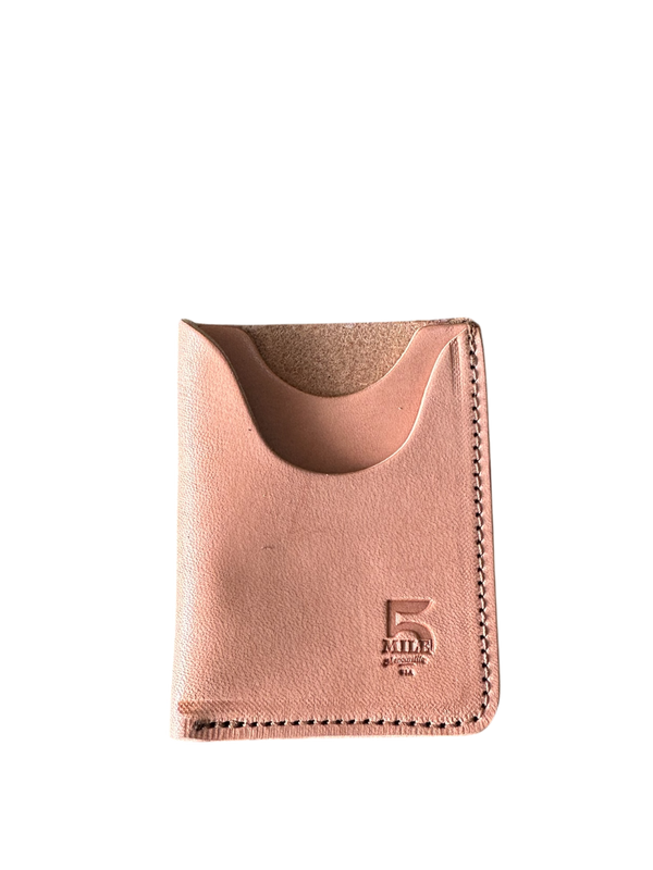 Rose gold cardholder with brand logo on a white background